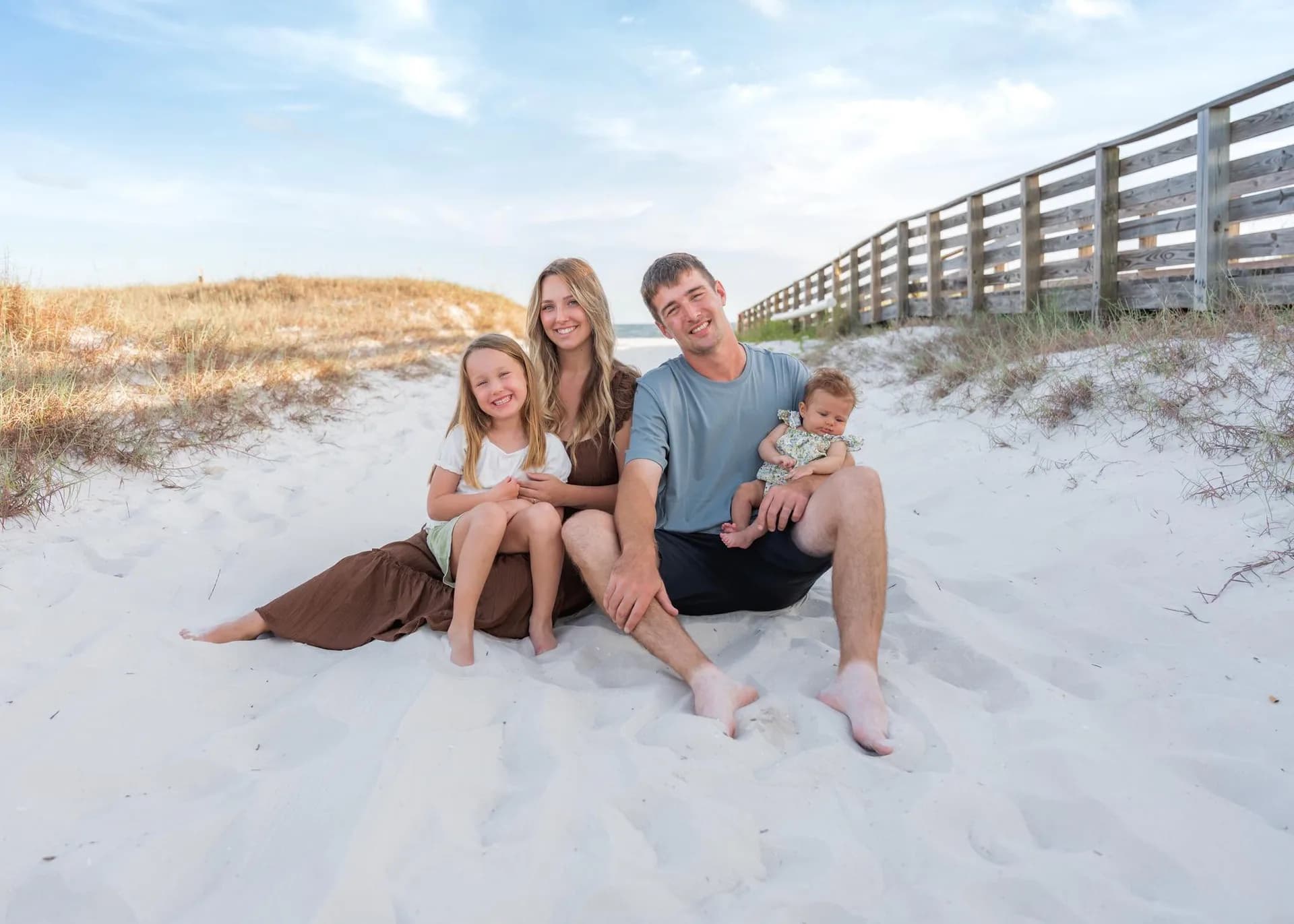 Angel with her husband and children on the beach